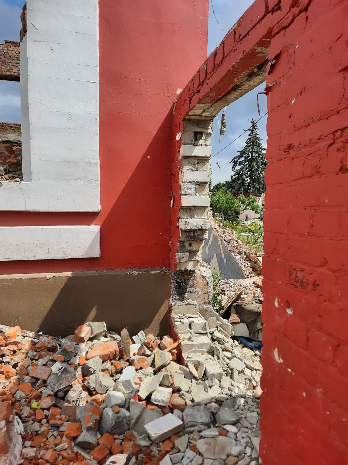 Brick demolition debris beside a building